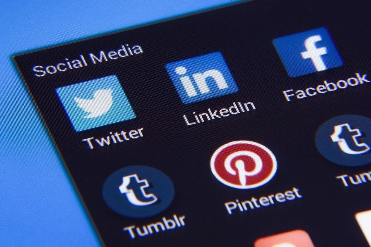 Close up of social media platform icons on a phone screen
